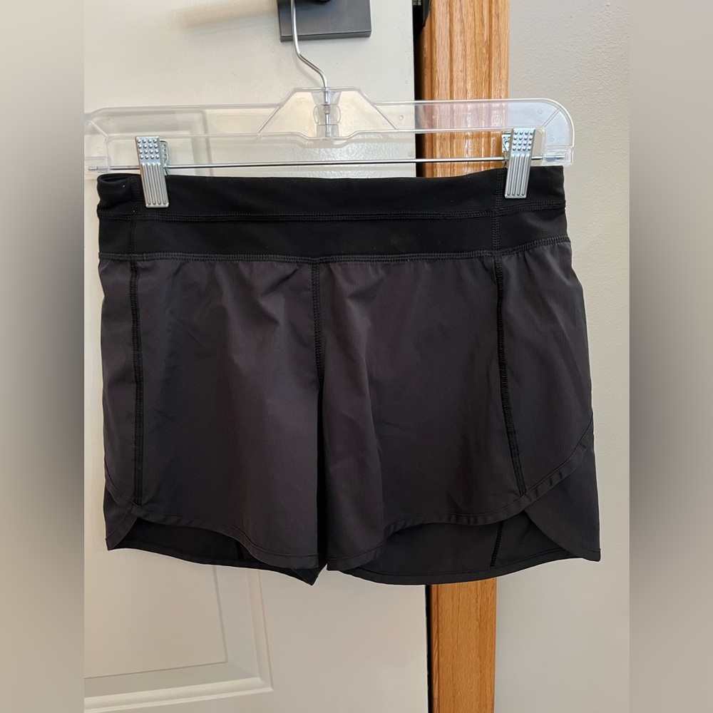 Girls Ivivva black shorts with elastic drawstring waist and liner. Size 14